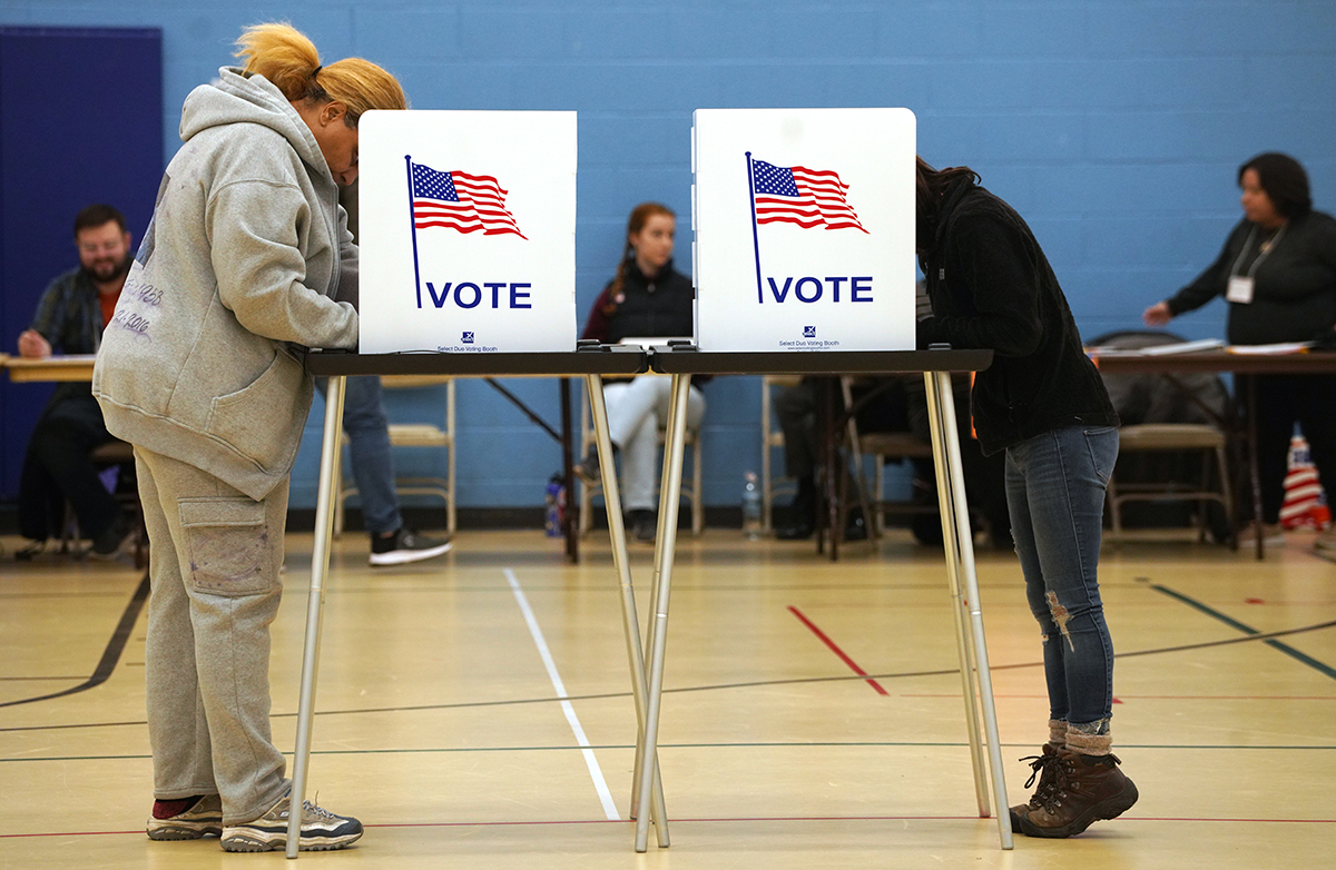 Two voters vote in the 2022 midterm elections.